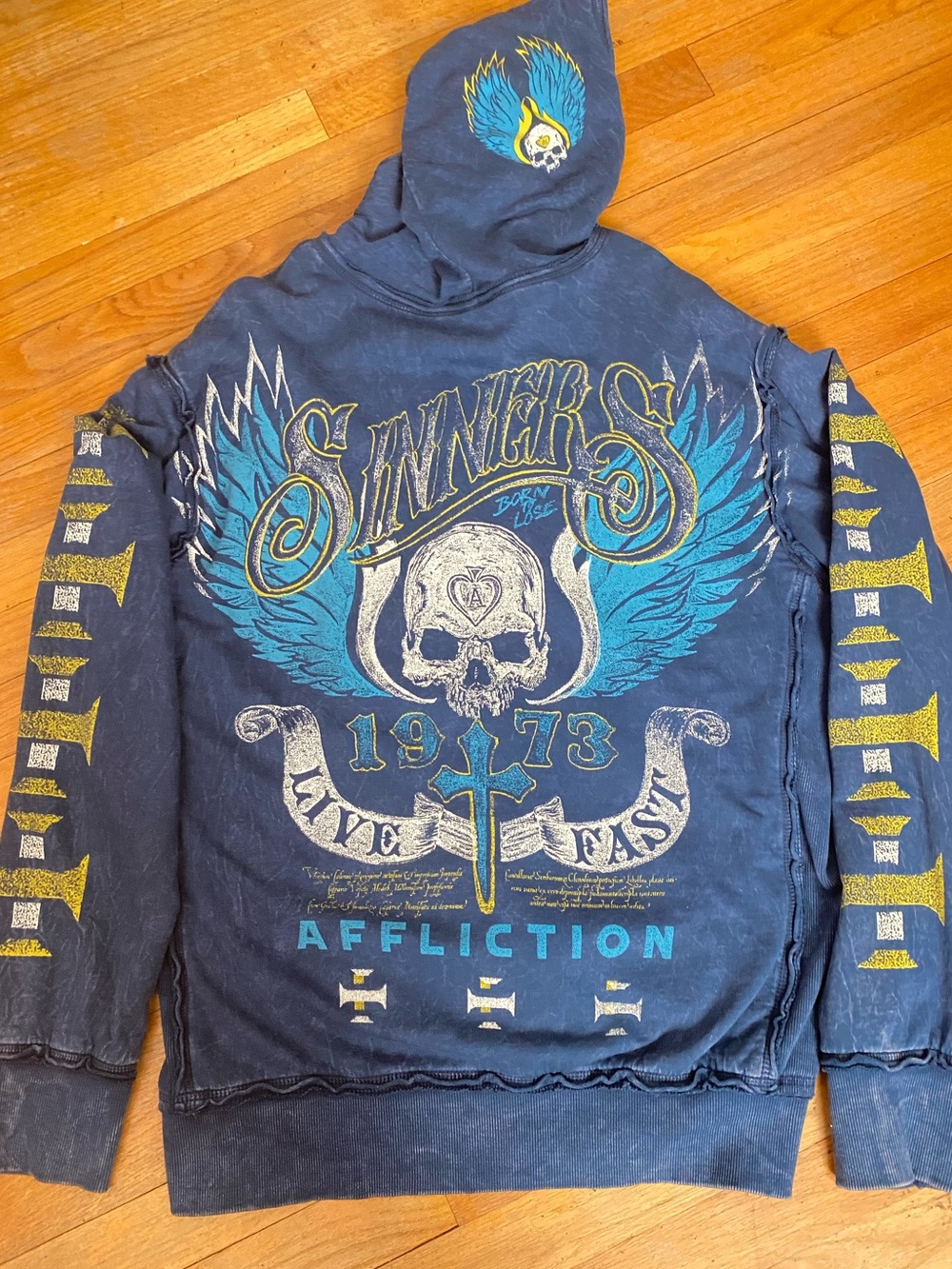 Affliction Navy Hoodie with Teal & Yellow Skull Wing Graphic